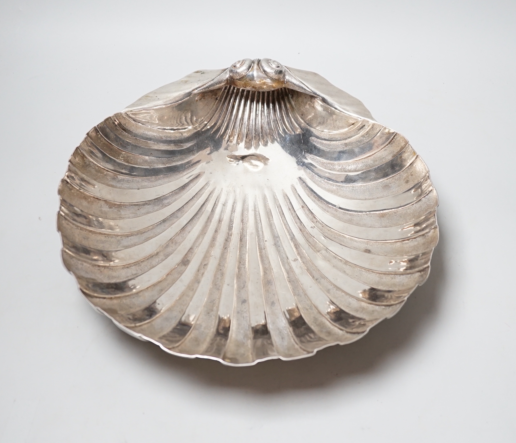 A 19th century Austro-Hungarian with metal fruit bowl, modelled as a half shell, on three shell feet, 34.3cm, 34.4oz.